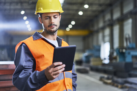 Man using tablet in factory stock photo