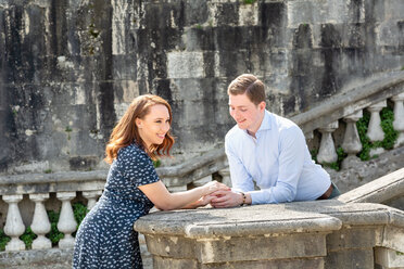 Young couple relaxing by San Miniato al Monte Church, Florence, Toscana, Italy - CUF44089