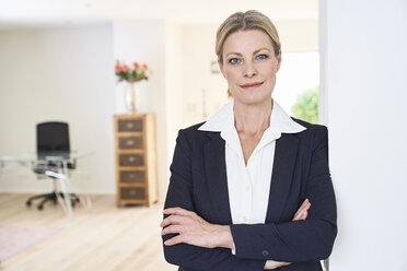 Portrait of confident businesswoman at home - PDF01766