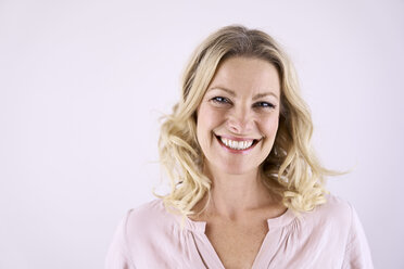 Portrait of smiling blond woman - PDF01787