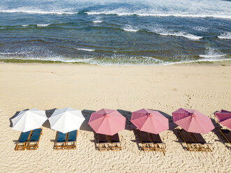 Indonesia, Bali, Aerial view of Balangan beach, sunloungers and beach umbrellas - KNTF02056