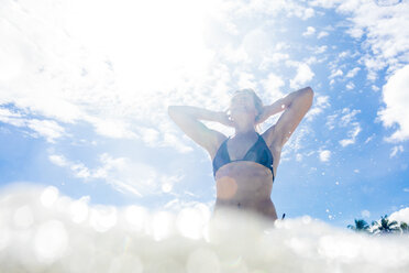 Woman in sea, low angle view, Nacpan Beach, Palawan, Philippines - CUF44569