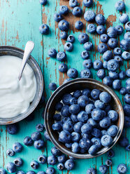 Still life with bowl of blueberries and yogurt, overhead view - CUF44638