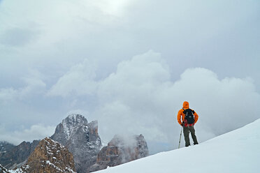 Hiker admiring view, Canazei, Trentino-Alto Adige, Italy - CUF44980