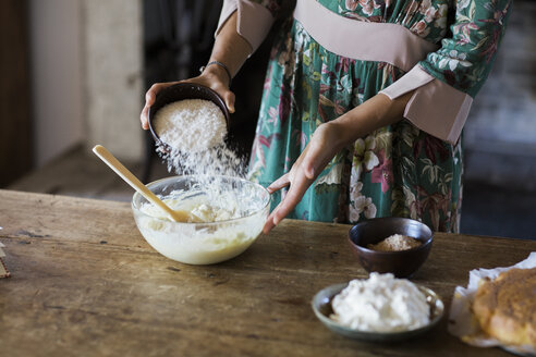 Young woman preparing cake dough, partial view - ALBF00594