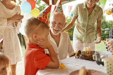 Happy extended family on a garden birthday party - ZEDF01667