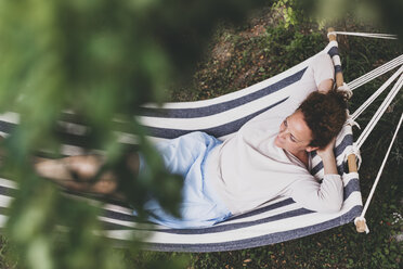 Woman lying in a hammock - HMEF00020