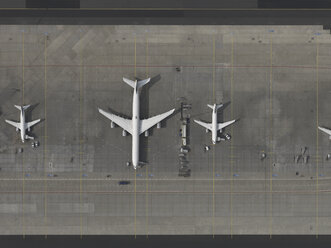 Aerial view airplanes parked on tarmac at airport - FSIF03234
