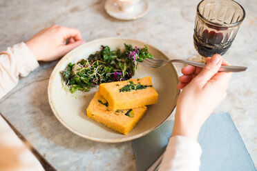 Woman having vegan meal in restaurant - CUF45870