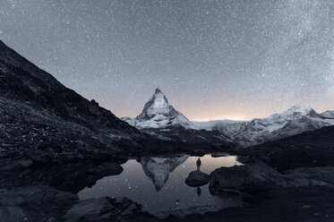 Matterhorn reflecting over Lake Riffelsee at night, Zermatt, Valais, Switzerland - CUF45904