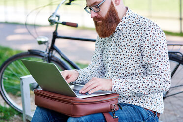 Bearded man using laptop - CUF45936