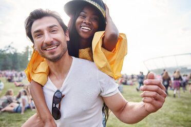 Couple laughing and enjoying music festival - CUF46028