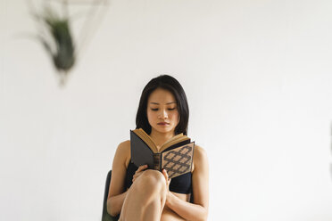 Woman in Lingerie Sitting Reading a Book Our beautiful pictures