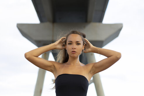 Portrait of beautiful young woman under a bridge - AFVF01731