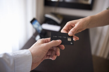 Handing over credit card - DIGF05119