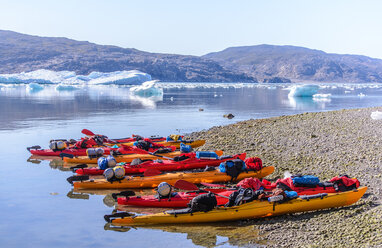 Sea kayaks on beach, Narsaq, Kitaa, Greenland - CUF46051