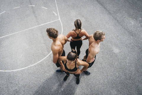 Group of young people in good shape, training on a sportsfield stock photo