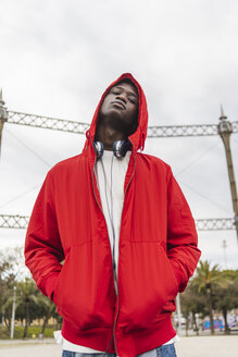 Portrait of a young black man wearing red hoodie - AFVF01808