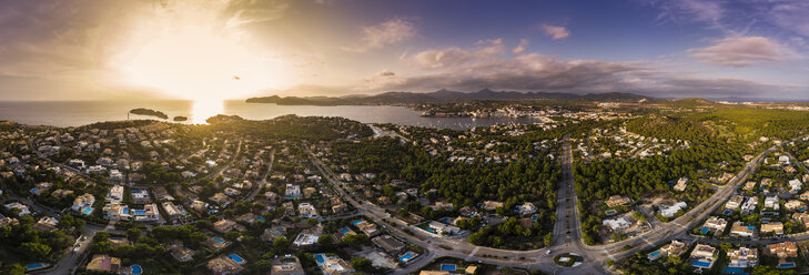 Spain, Balearic Islands, Mallorca, Region Calvia, Aerial view of Santa Ponca and Serra de Tramuntana at sunset - AMF06028