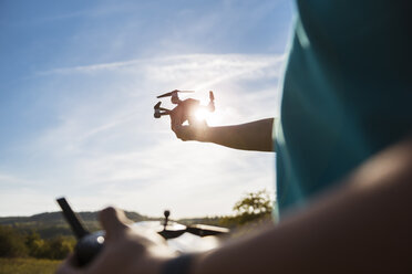 Boy flying a drone outdoors - DIGF05133