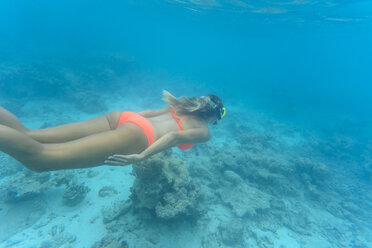 Woman wearing bikini while swimming undersea at Maldives - CAVF49591