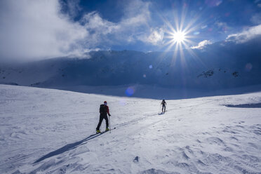 Two men doing a ski tour in Faragas mountains, Southern Carpathians, Romania - HAMF00499