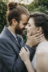 Happy affectionate bride and groom outdoors - ALBF00679