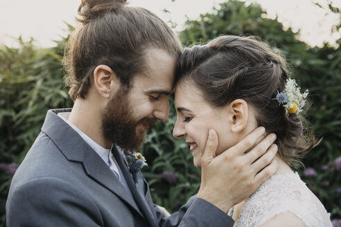 Happy affectionate bride and groom outdoors - ALBF00680