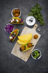 Sweet potato falafel in taco shells, with red cabbage, salad, carrot, yogurt sauce and black sesame - LVF07476