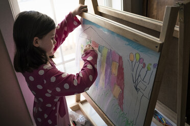 High angle view of cute girl drawing on artist's canvas at home - CAVF49794