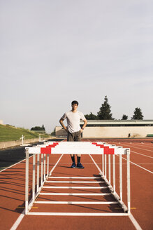 Young runner preparing for hurdle race - ACPF00348