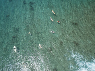 Aerial view of people surfing on sea at Maldives - CAVF50167