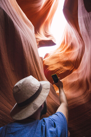 USA, Arizona, Lower Antelope Canyon, tourist photographing stock photo
