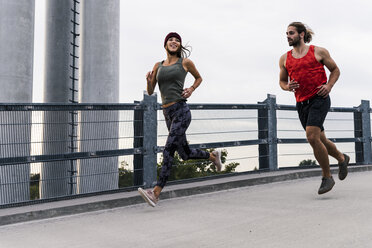 Young couple jogging in the morning - UUF15574