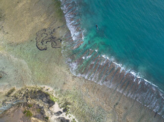 Indonesia, Lombok, Aerial view of beach, banca boat - KNTF02203