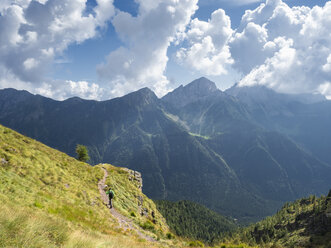 Italy, Lombardy, Valle di Scalve, hiker on hiking trail, Mount Camino - LAF02108