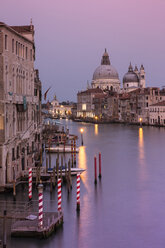 Grand Canal amidst buildings in city against sky during sunset - CAVF50784