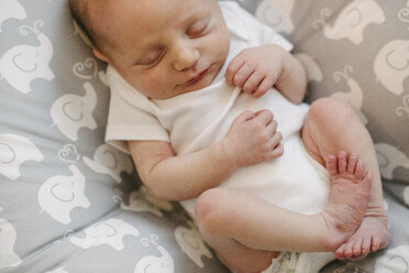 High angle view of newborn baby girl sleeping on bed at home - CAVF51001