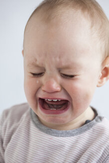 Portrait of crying baby girl - JLOF00282
