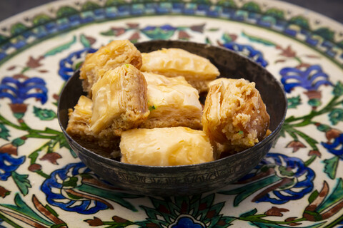 Baklava in a bowl, on plate stock photo