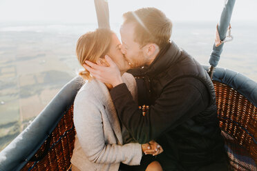 Newly engaged couple in hot air balloon - CUF46335