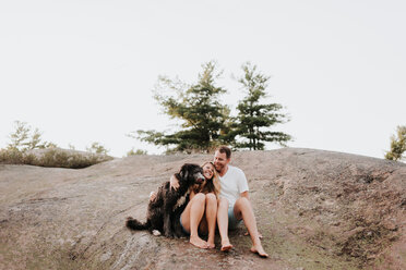 Couple with pet dog, Algonquin Park, Canada - CUF46352