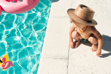 Toddler at swimming pool in summer - CUF46375