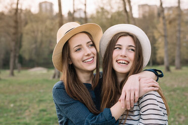 Happy girlfriends in park - CUF46461