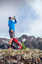 Hiker taking break, Mount Sneffels, Ouray, Colorado, USA - ISF20104