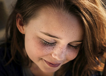 Close-up of happy girl with eyes closed - CAVF51651