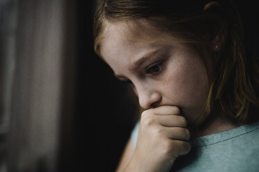 Close-up of thoughtful girl looking down - CAVF51717