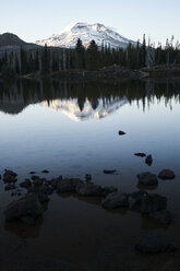 Scenic view lake against snowcapped mountain - CAVF51760