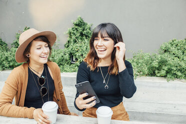 Cheerful female friends at table - CAVF52219