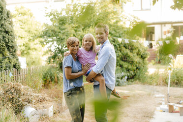 Portrait of happy family in garden - KNSF05117